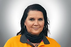 Porträt einer Frau in Arbeitskleidung