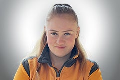 Porträt einer Frau in Arbeitskleidung