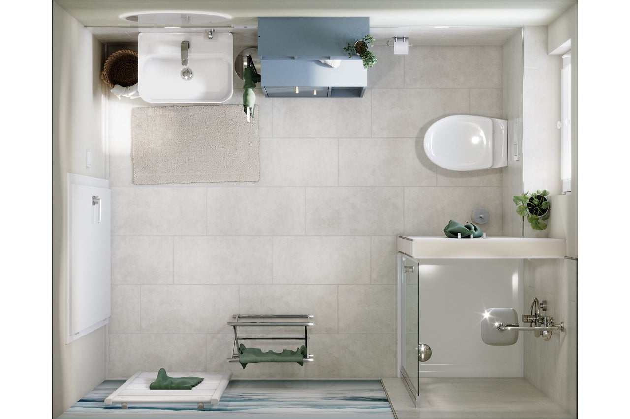 Ansicht von oben auf ein Badezimmer mit Waschbecken, Toilette, Dusche und Accessoires.