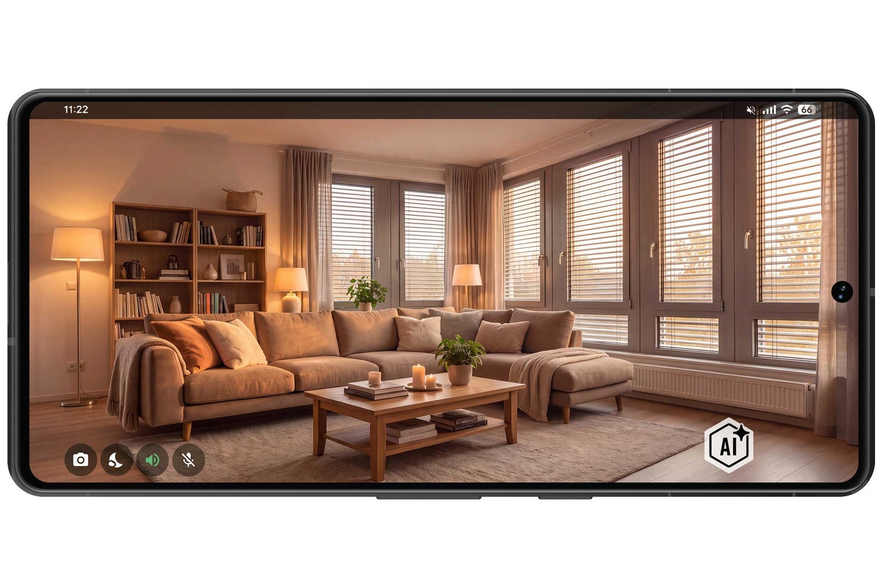 Wohnzimmer mit Sofa, Couchtisch und Bücherregal auf einem Smartphone Bildschirm dargestellt.