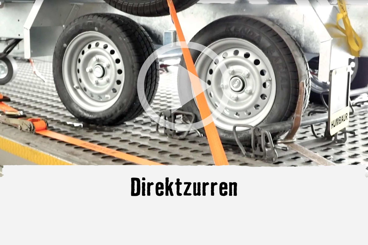 
			Direktzurren zur Ladungssicherung auf einem Anhänger.
		