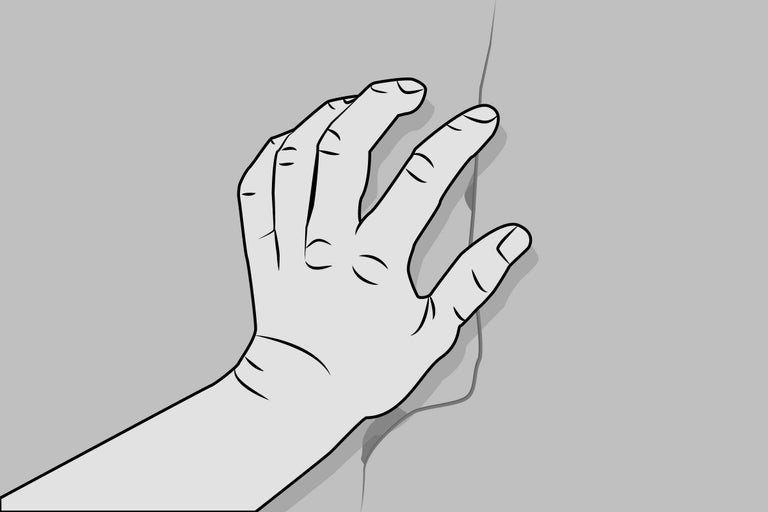Hand auf einem Riss in der Wand