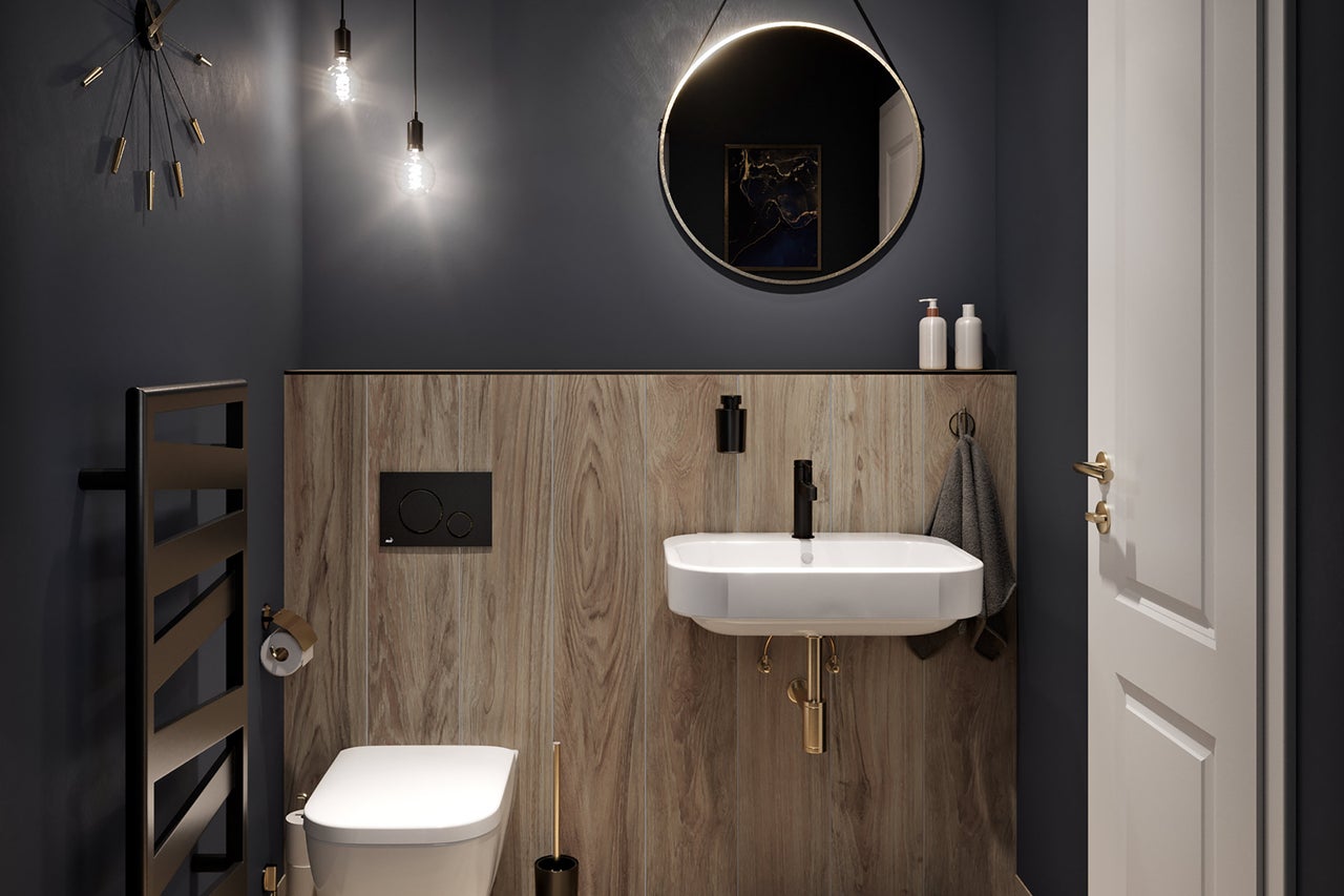Modernes Badezimmer mit Toilette, Waschtisch, Spiegel und Heizkörper