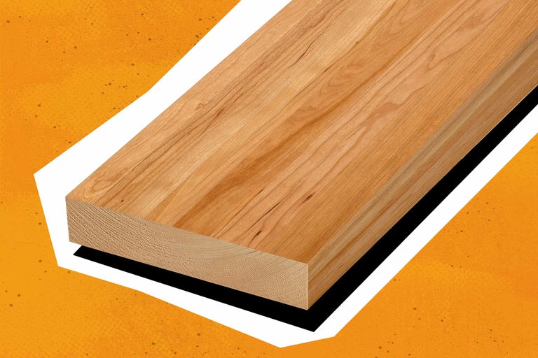 Holzbrett Kirschbaum auf orangenem Hintergrund