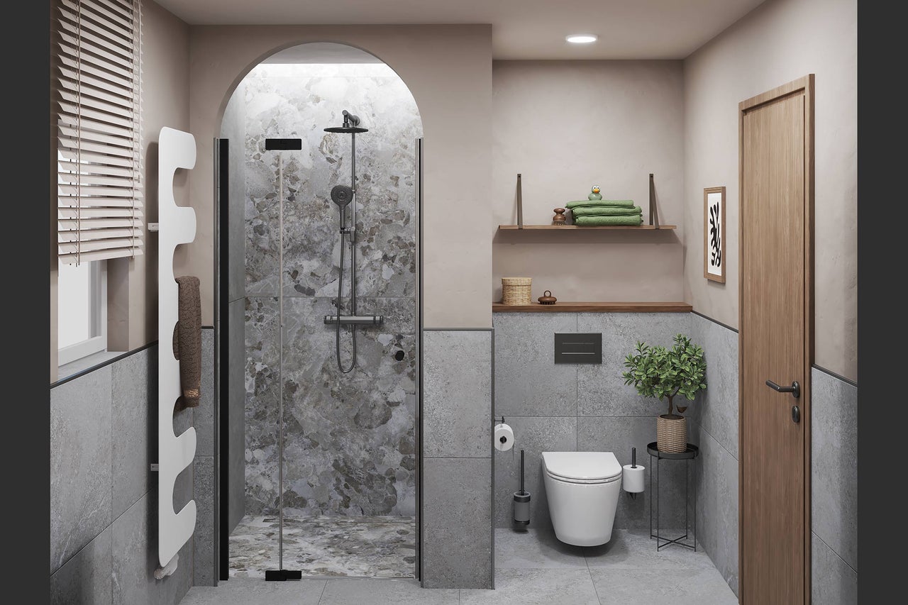 Modernes Badezimmer mit Rundbogendusche, Wand-WC, weißem Designheizkörper und großformatigen Fliesen in Steinoptik.