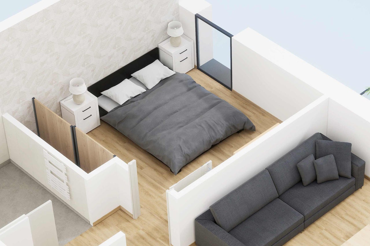 Ansicht eines Schlafzimmers mit Bett, Nachttischen, Lampen und Sofa