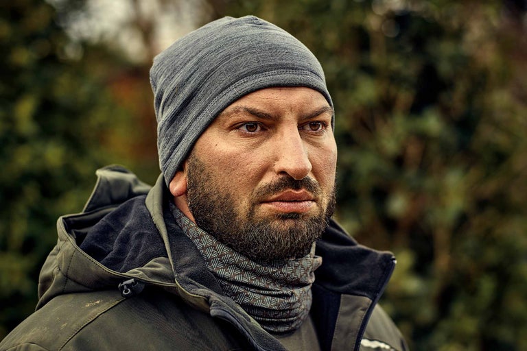 Porträt eines Mannes mit Mütze und Winterjacke