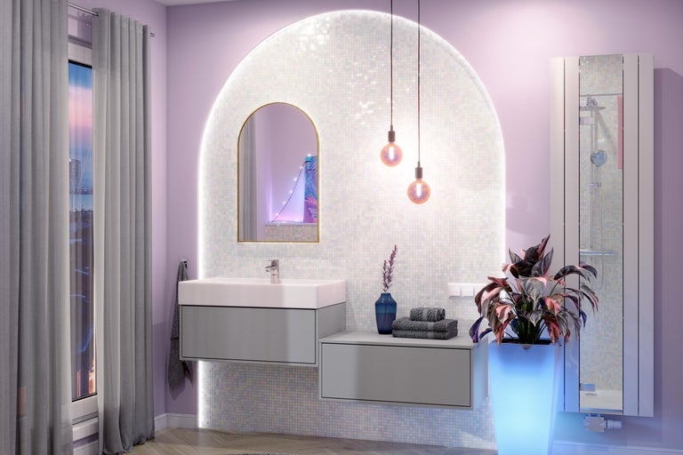 Modernes Badezimmer mit grauem Waschtischunterschrank, weißem Waschbecken, Rundbogenspiegel und beleuchteter Mosaikwand.