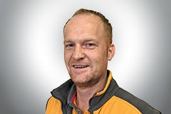 Porträt eines Mannes in Arbeitskleidung