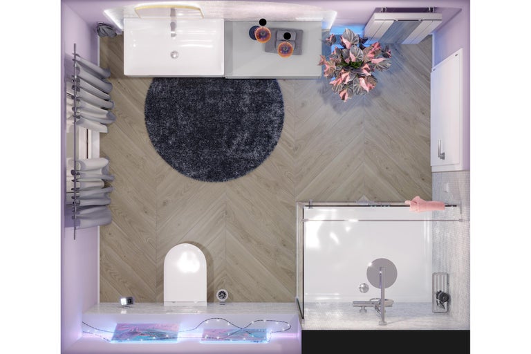 Draufsicht auf ein modernes Badezimmer mit Bodenfliesen in Holzoptik im Fischgrätmuster, weißem Waschtisch, WC, Glasdusche und rundem Teppich.