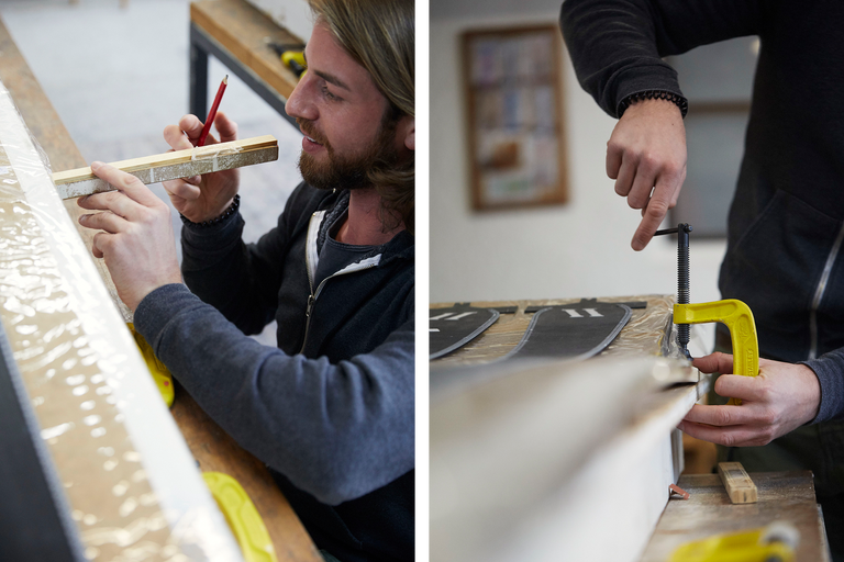 Ein Mann markiert mit einem Bleistift Holz. Eine gelbe Schraubzwinge fixiert ein Werkstück.