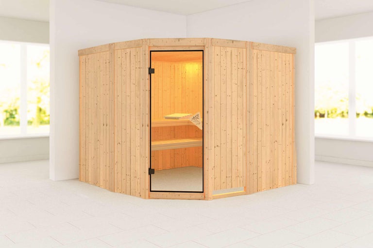Ecksauna aus Holz mit Glastür in einem hellen Raum.