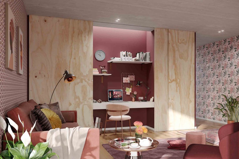 Wohnzimmer mit Arbeitsbereich, Sofa, Tisch und Büromöbeln in hellem und organisiertem Design.