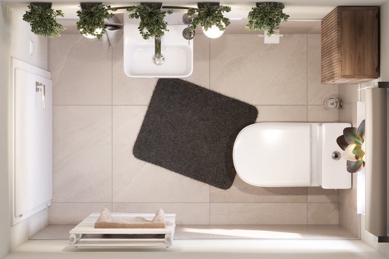 Draufsicht eines hellen Badezimmers mit Toilette, Waschbecken, Badteppich und Handtuchwärmer