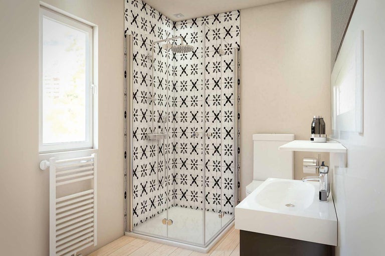 Badezimmer mit Dusche, Waschbecken, Toilette und Heizkörper