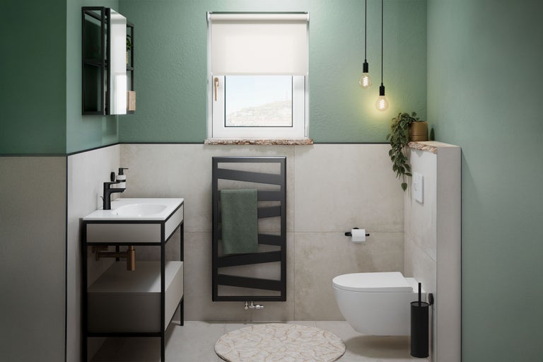 Badezimmer mit Waschtisch, Heizkörper, Toilette und Fenster