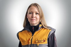 Porträt einer Frau in Arbeitskleidung