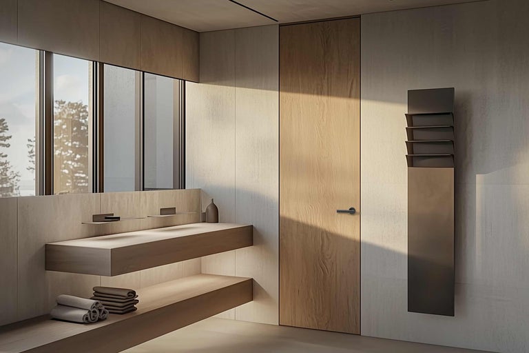 Modernes Badezimmer mit Waschtisch, Spiegel, Handtüchern und Heizkörper