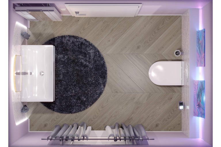 Draufsicht eines modernen Badezimmers mit Bodenbelag in Holzoptik im Chevron-Muster, rundem Teppich, weißem Waschbecken und Hänge-WC.