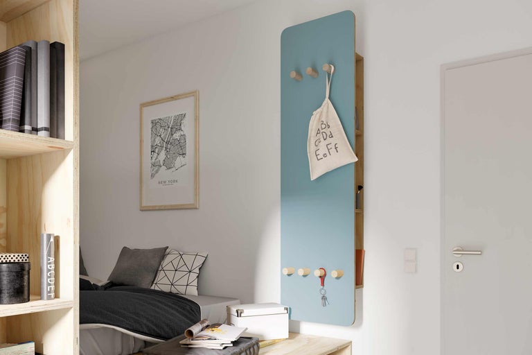 Modernes Jugendzimmer mit Regal, Bett und Wandgarderobe