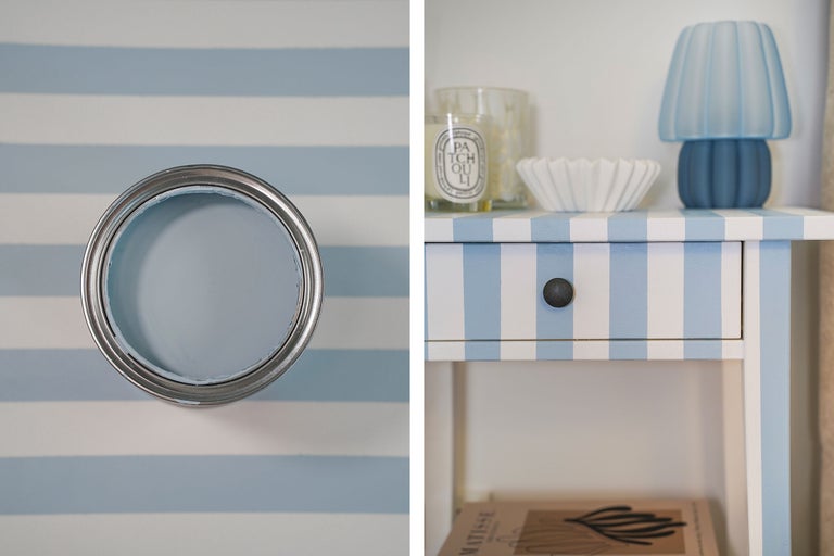 Farbdose mit blauer Farbe und gestreifter Nachttisch im maritimen Stil.