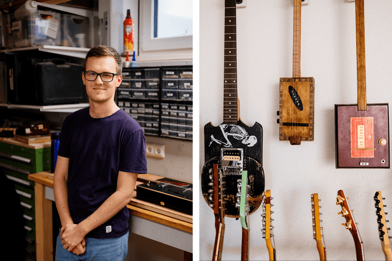 Mann steht in Werkstatt mit selbstgebauten Gitarren