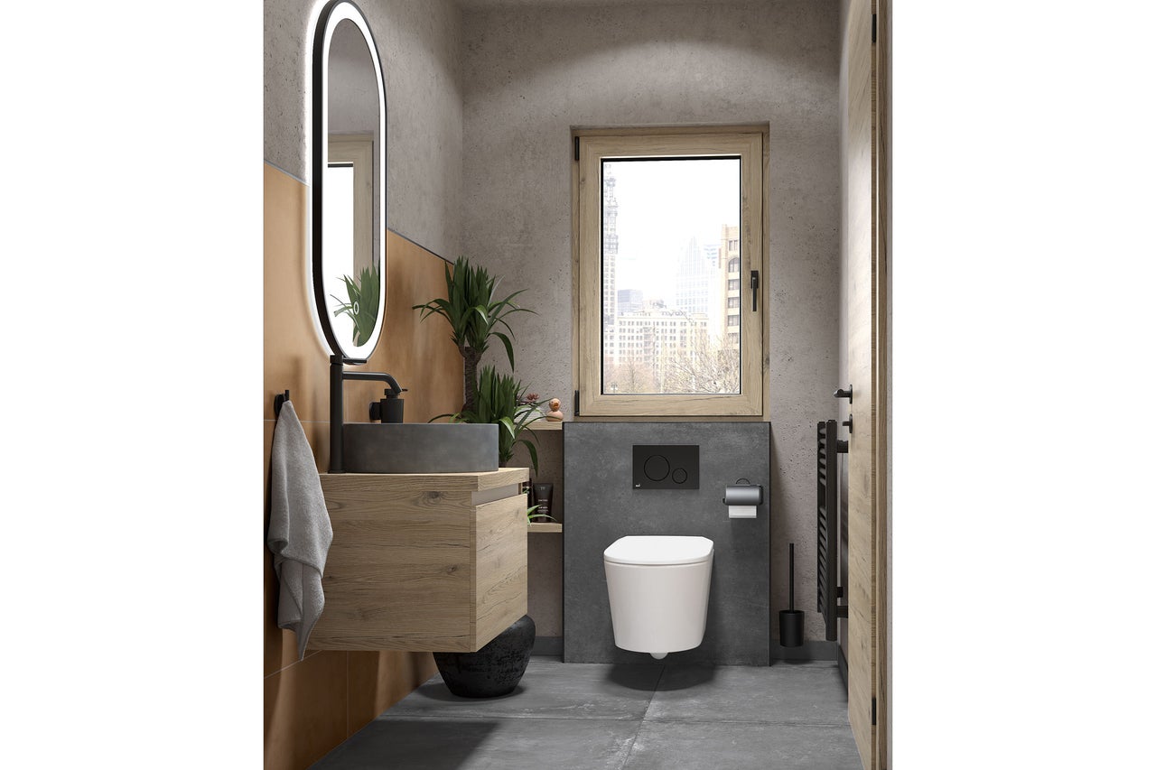 Gästetoilette mit Wänden in Betonoptik, Holz-Waschtischunterschrank mit Steinbecken, ovalem beleuchtetem Spiegel und wandhängender Toilette.