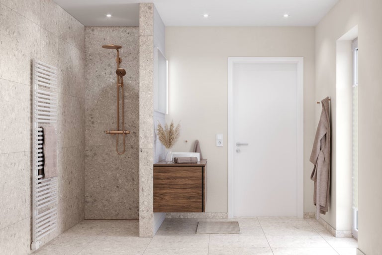 Modernes Badezimmer mit begehbarer Dusche, Terrazzo-Fliesen, kupferfarbenen Armaturen und einem Waschtischunterschrank in Holzoptik.