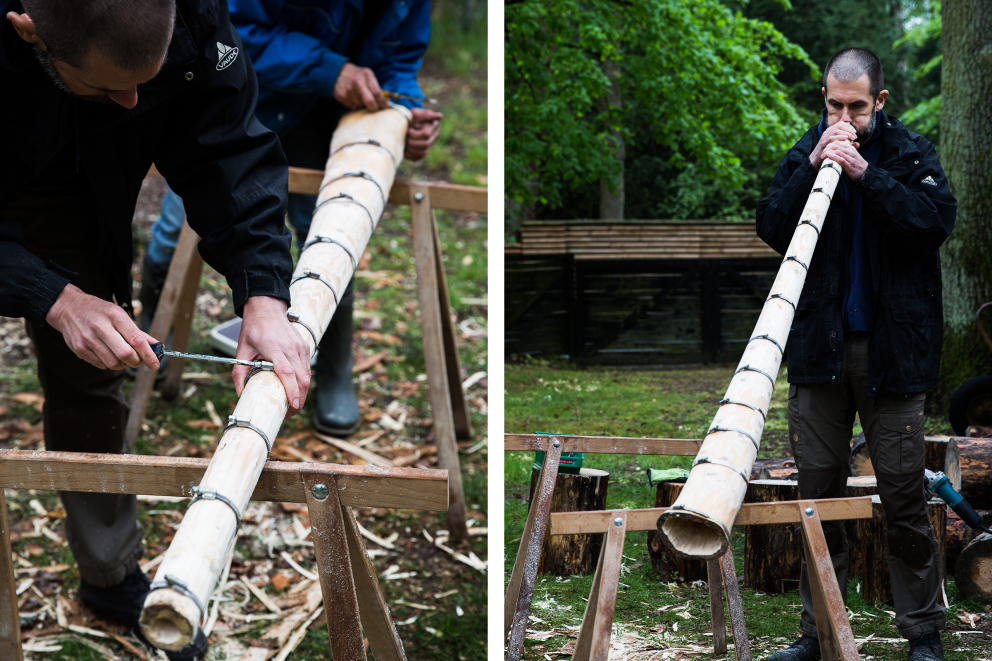 Autor Sascha Borrée legt gemeinsam mit Workshopleiter und Didgeridoo Baumeister Wolfgang Lüttig die Baumstamm Hälften aufeinander und dreht Schlauchschellen fest. Sieht schon fast nach einem Didgeridoo aus Autor Sascha Borrée legt gemeinsam mit Workshopleiter und Didgeridoo Baumeister Wolfgang Lüttig die Baumstamm Hälften aufeinander und dreht Schlauchschellen fest. Sieht schon fast nach einem Didgeridoo aus