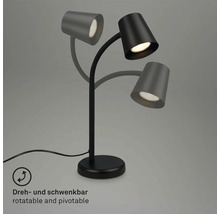 Schwarze Tischleuchte mit drei schwenkbaren Leuchtenköpfen zur flexiblen Ausrichtung des Lichts