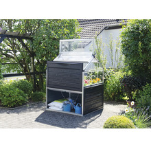 Gewächshaus mit Pflanztisch und Aufbewahrung im Garten.