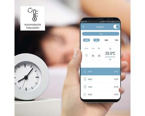 Smartphone mit Heizprogramm neben einer Uhr
