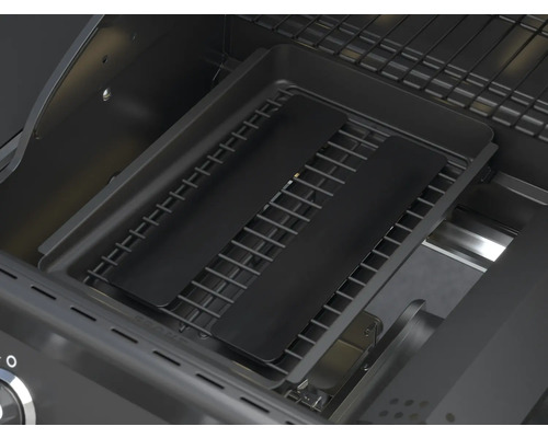 Innenansicht eines Gasgrills mit Grillrost und Abdeckblechen