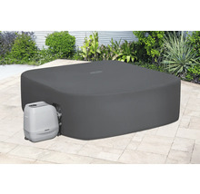 Abgedeckter Whirlpool mit Pumpe im Garten.