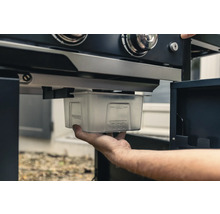 Auffangschale unter einem Grill.