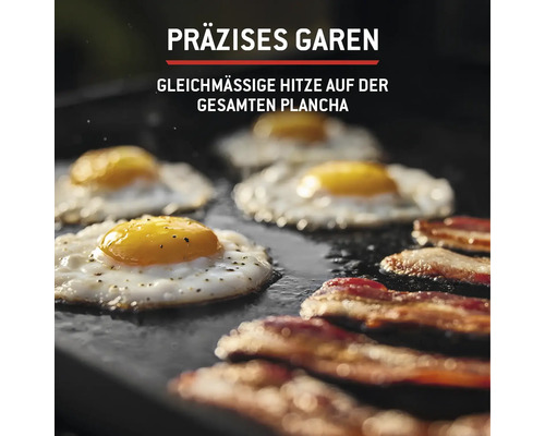 Spiegeleier und Speck auf einer Grillplatte