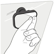 Eine Hand stellt einen kleinen rechteckigen Toter-Winkel-Spiegel ein der an einer Glasscheibe befestigt ist.