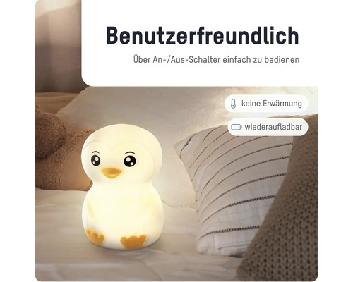 Warm leuchtendes Pinguin-Nachtlicht für Kinder auf einem Bett, wiederaufladbar, keine Erwärmung, einfache Bedienung per Ein- und Ausschalter.