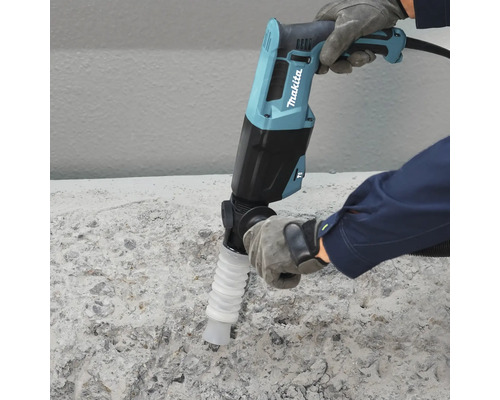 Makita Meißelhammer mit Staubabsaugung wird auf einer Betonoberfläche verwendet. Makita Logo.