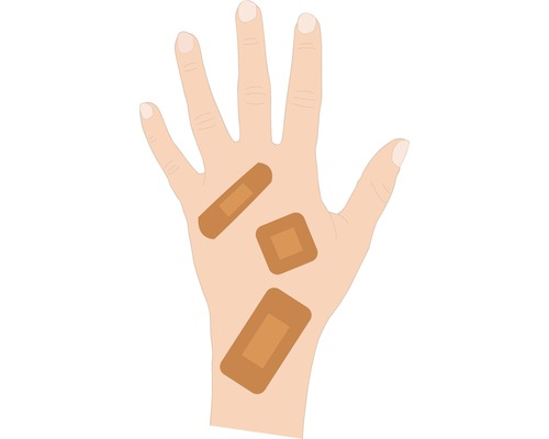 Hand mit Pflastern unterschiedlicher Form