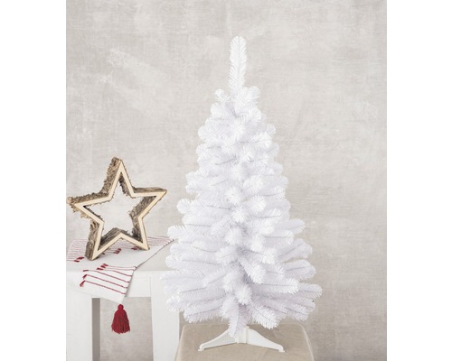 Weihnachtsdekoration mit weißem Tannenbaum und Holzstern