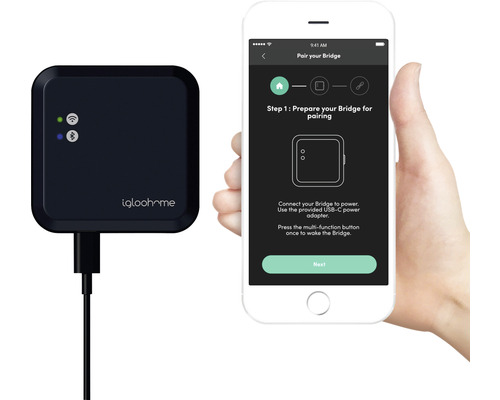 igloohome Bridge neben einem Smartphone mit der igloohome App zur Gerätekopplung