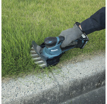 Makita Grasschere bei der Rasenpflege