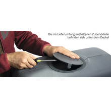 Zubehör unter dem Deckel eines Pflanzkastens wird mit einem Schraubenzieher montiert.