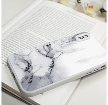 Handyhülle mit Marmorstruktur auf einem Buch