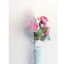 Dekorfolie mit Ornamentstruktur neben einer Vase mit Blumen