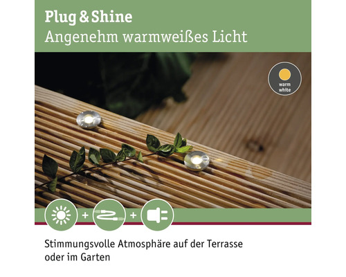 Plug and Shine Bodenleuchten auf einer Holzterrasse für stimmungsvolle Beleuchtung