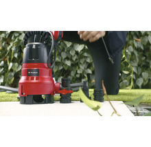 Einhell Schmutzwasserpumpe mit Zubehör auf Steinfläche