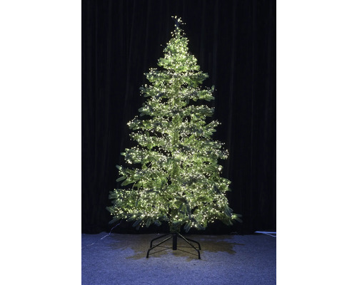 Künstlicher Weihnachtsbaum mit Beleuchtung auf einem Ständer