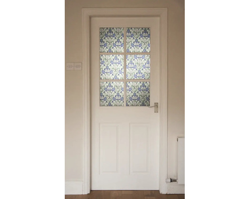 Weiße Tür mit floralem Glasdekor.